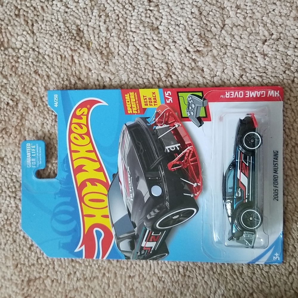 Collectable mechanix hot wheels gloves and car